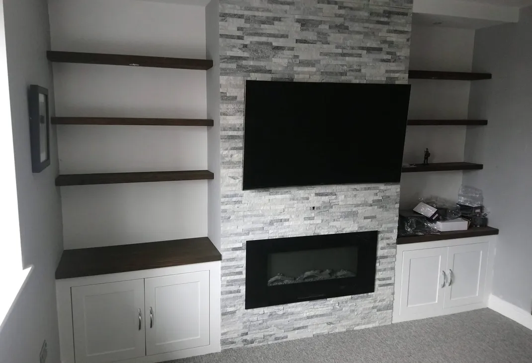 New tiled false wall with TV and fire