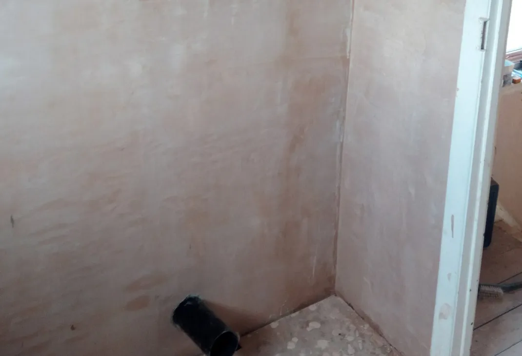 Newly plastered bathroom wall