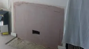 Fireplace removal and new wall plastering
