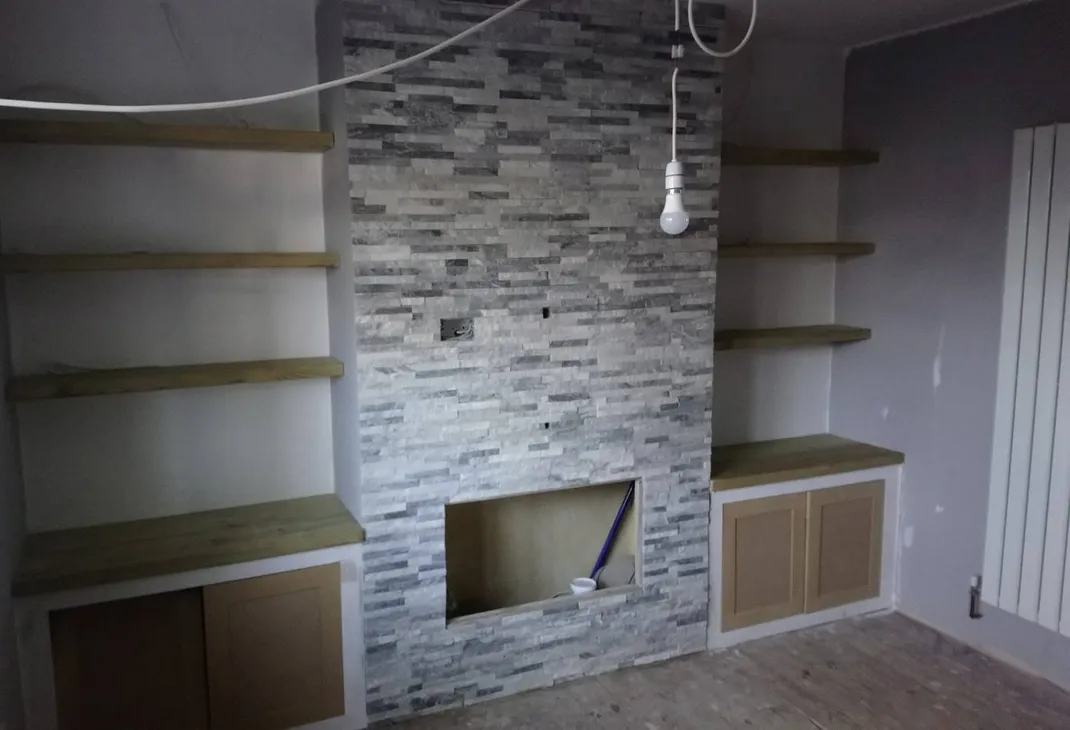 Newly tiled false wall with vertical radiator