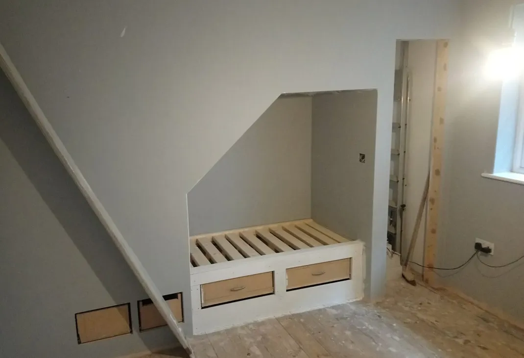 Understairs reading area with useful storage areas